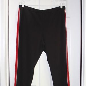 Black pants with white and red stripe on side